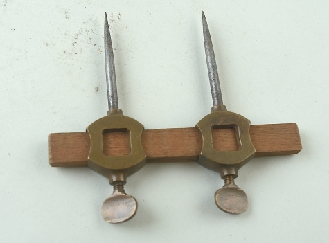 Brass and steel trammel points with square cutout
