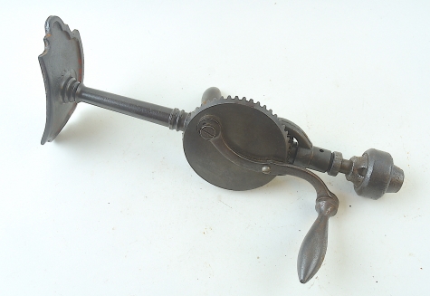 Ornate breast drill with universal chuck